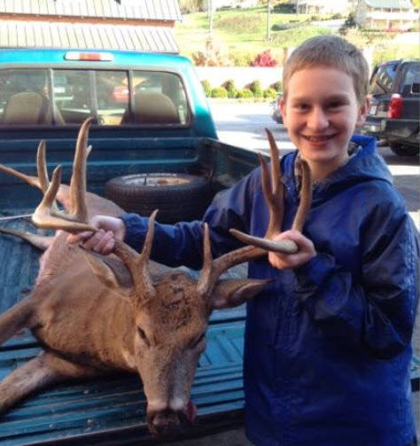 2013 Russell Pinnell of New Haven with his 1st deer, a large 12 point buck, ready to be made into steaks, chops, summer sausage, jerky and bratwurst at Hermann Wurst Haus.